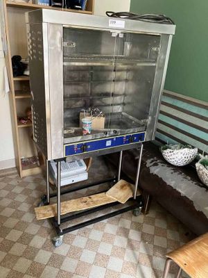 an image of a kitchen with a stove and a couch