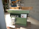 a machine that is sitting on a pallet in a building