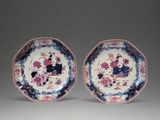 pair of chinese plates with flowers and birds in blue, pink, and white