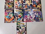 several pokemon comics are lined up on a white surface