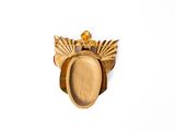 a picture of a gold plate with a crown on it