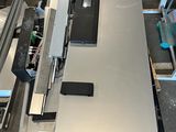 a table that has a laptop on it in the middle of a room