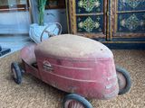 a small toy car that is sitting on the floor