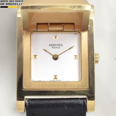 an image of a close up of a watch on a white surface