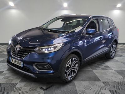a blue renault kad suv parked on a checkered floor