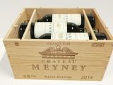 three bottles of wine in a wooden box