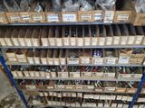 many boxes of tools on a shelf in a warehouse