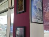 pictures hanging on the wall of a restaurant