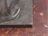 a picture of a statue of a dolphin on a marble table