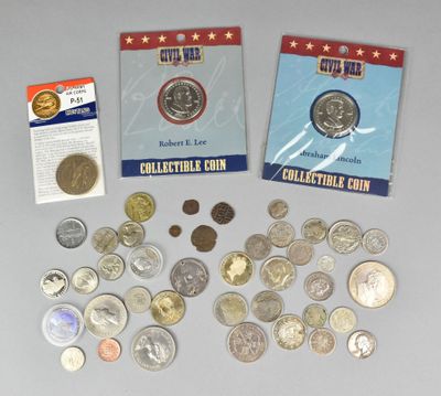 some coins are sitting on top of a table next to a card