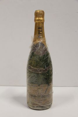 an image of a bottle of champagne wrapped in a plastic wrap