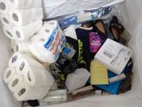 a bag full of toilet paper, toilet paper, and other items