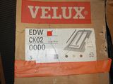 a cardboard box with a picture of a veluxx window