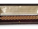 a box that has a bunch of gold rings in it