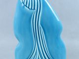 a blue sculpture of a jellyfish on a white background