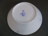 a white bowl with a blue bird on it