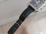 a watch that is sitting on top of a glass table