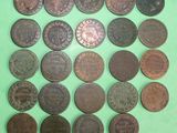 a lot of coins that are on a green surface
