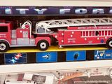 a toy fire truck and a toy fire truck in a display case