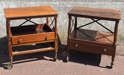 two small tables with drawers on them on wheels