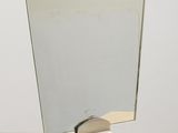 a mirror that is on top of a table
