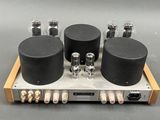 a close up of a stereo amplifier on a wooden stand
