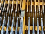 a lot of knives in a case with a knife in it