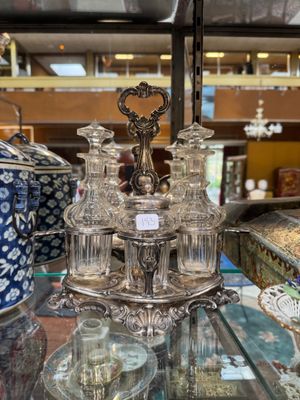 a glass table with a lot of glass items on it