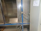 a picture of a room with a metal door and a blue tape