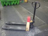 a forklift sitting on the ground in a warehouse