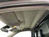 a view of the inside of a car from the driver ' s seat