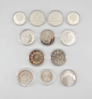 a close up of a bunch of coins on a white surface