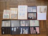 many different types of stamps on a wooden floor