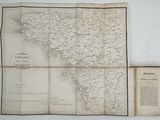 an old map of the state of north carolina with a book on it
