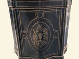 a black cabinet with a gold design on it