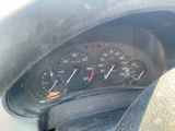 a close up of a car dashboard with a speedometer and gauges