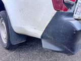 a close up of a car ' s bumper with a license plate on it