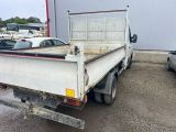 a white truck that is parked in a parking lot