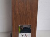 an image of a wooden speaker on a white surface