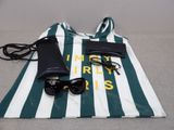 a bag with sunglasses, a cell phone, and a pair of sunglasses on it