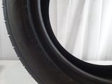 a close up of a tire on a white surface with a white background
