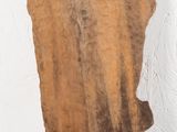 a piece of wood that is hanging on the wall