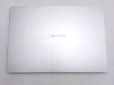 a laptop that is sitting on a white table