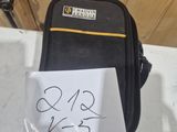 a small piece of luggage with a note attached to it