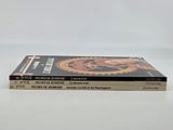 a stack of three books sitting on top of each other