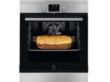 a close up of a toaster oven with a toast in it
