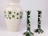 three vases sitting next to each other on a white surface