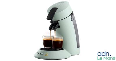 an image of a coffee maker with two cups of coffee in front of it