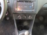 a car dashboard with a gear box and a steering wheel