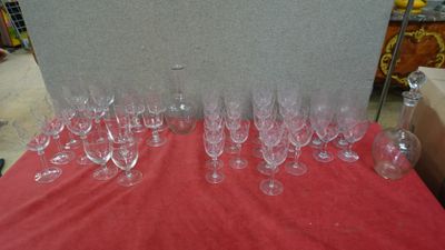 many empty wine glasses sitting on a red table
